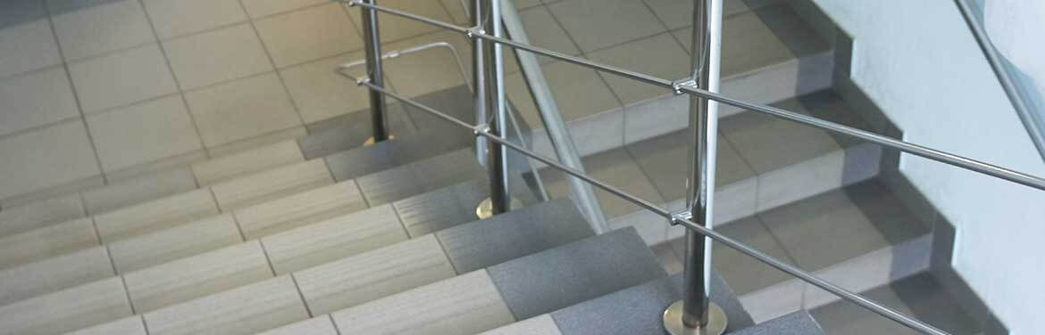Floor Polishing Services clean staircase with chrome railing