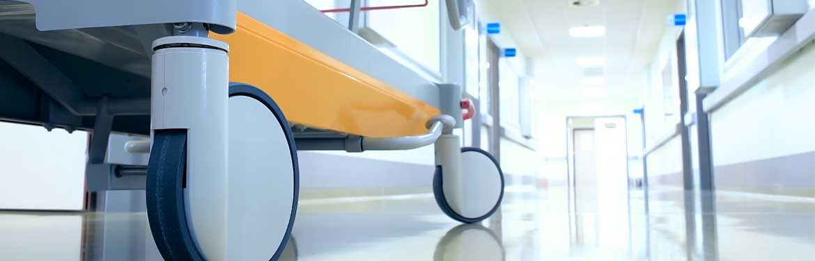closeup of hospital bed in hallway